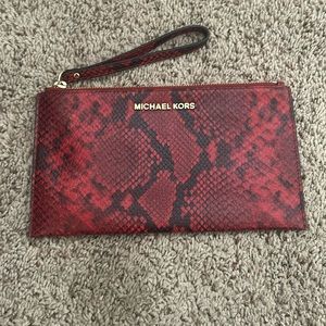 Lightly used Red snakeskin Michael Kors Purse with gold accents